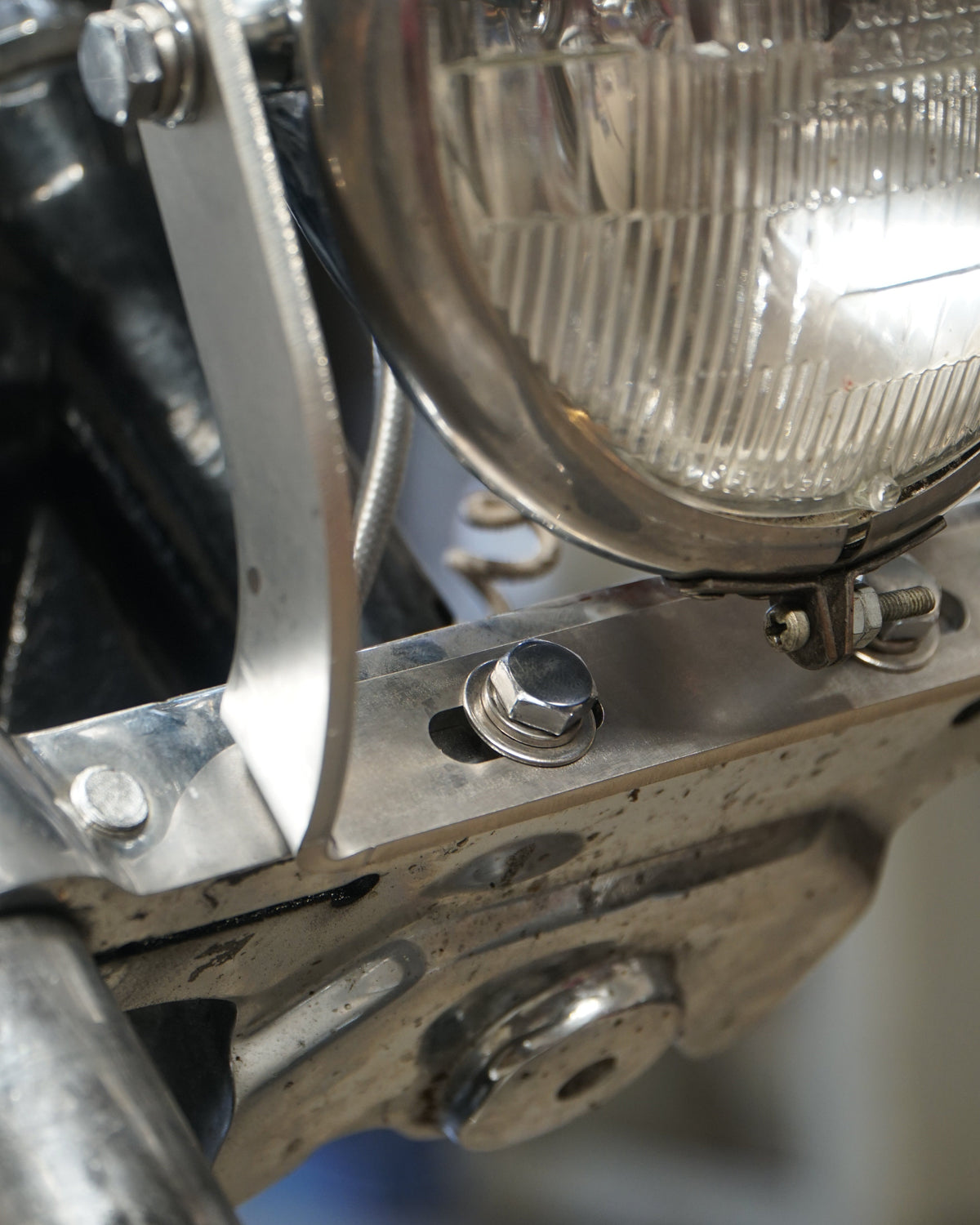 SIDE MOUNT HEADLIGHT BRACKET FOR BATES
